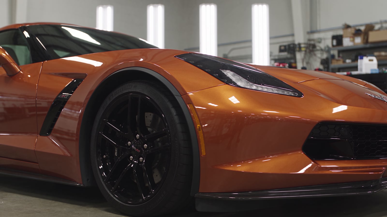 Copper Corvette C7 inside a workshop
